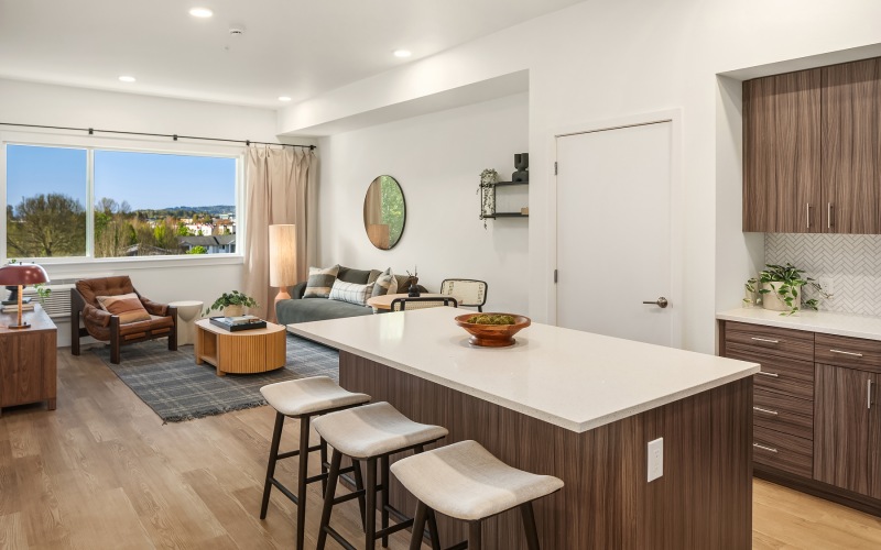 a kitchen island with stools