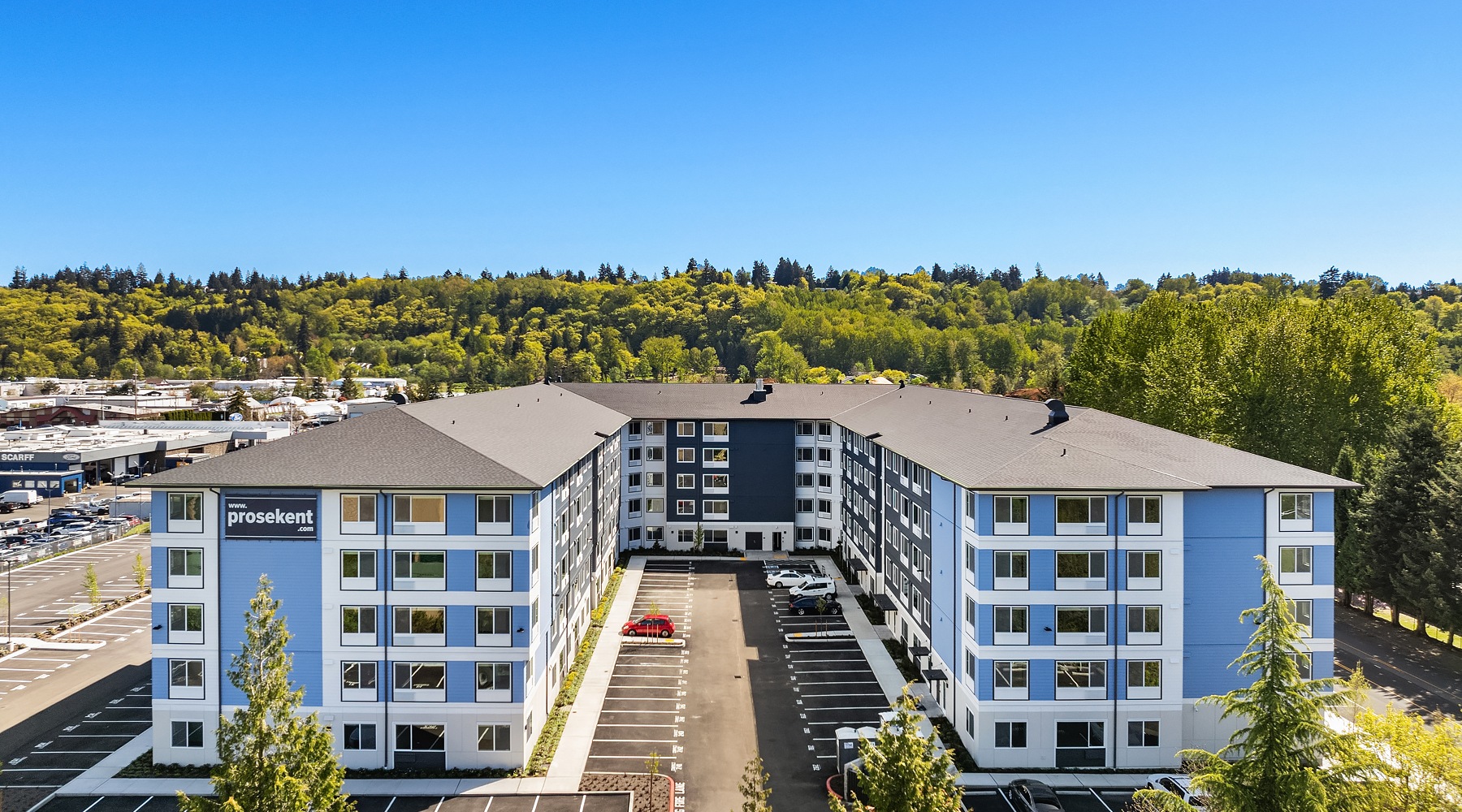 Live your story rendering of exterior building with nearby landscaping